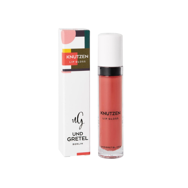 UND-GRETEL-KNUTZEN-LIP-GLOSS-01-MATTE-APRICOT UND GRETEL KNUTZEN Lip Gloss 01 Matte Apricot, Verpackung und Flasche, auf weißem Hintergrund.
