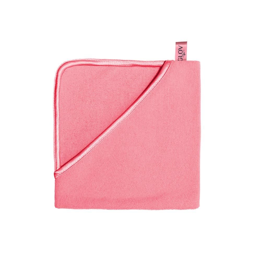 Rosa Mikrofaser-Handtuch mit umgeschlagener Ecke und Etikett.