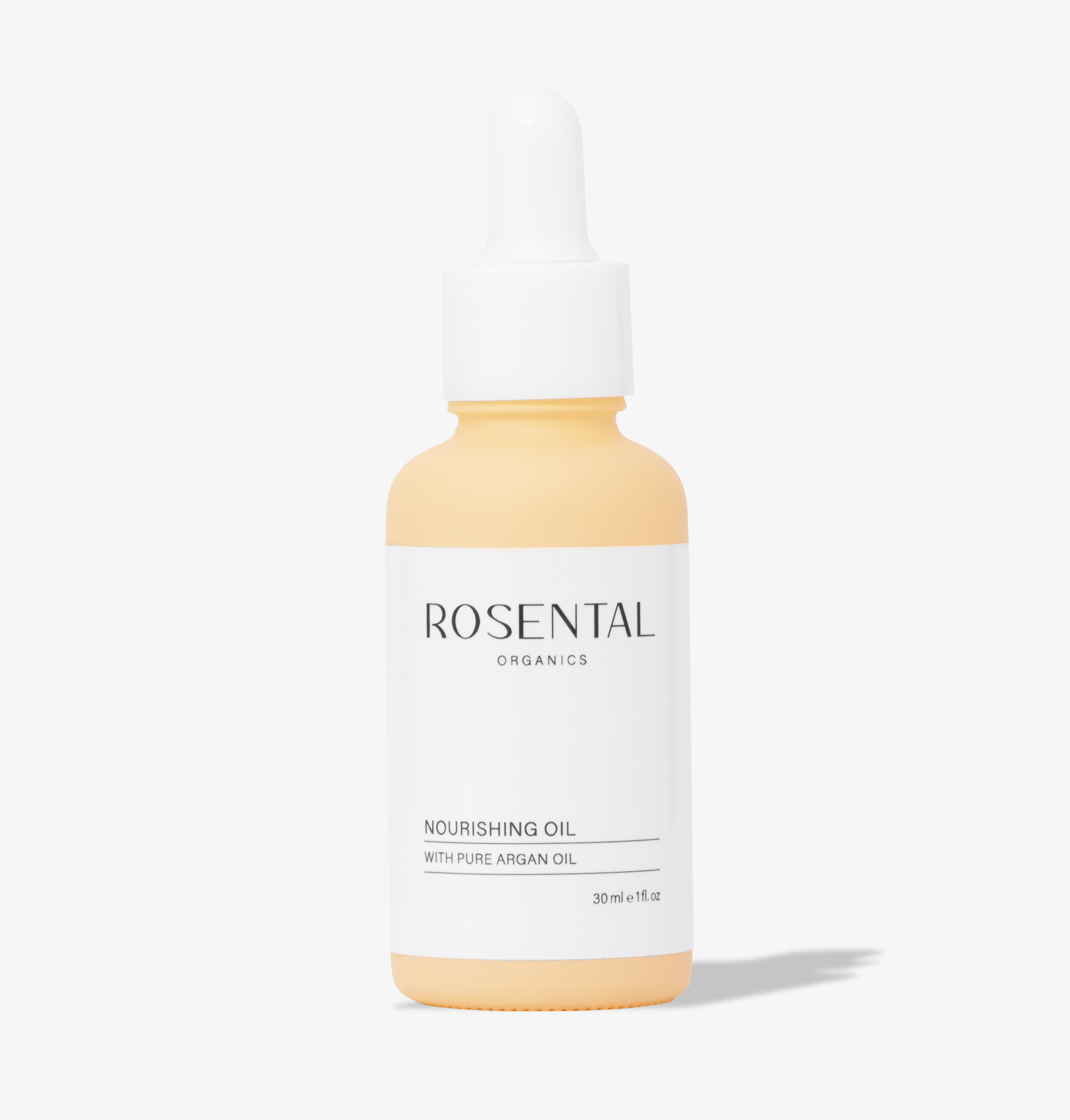 nourishing_oil_bild1 Flasche Rosental Organics Nourishing Oil mit Pipette, 30 ml, auf weißem Hintergrund.