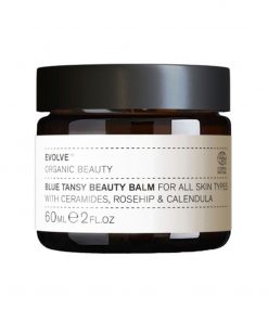 Evolve Organic Beauty Blue Tansy Beauty Balm für alle Hauttypen, 60ml, in einem braunen Glasbehälter.