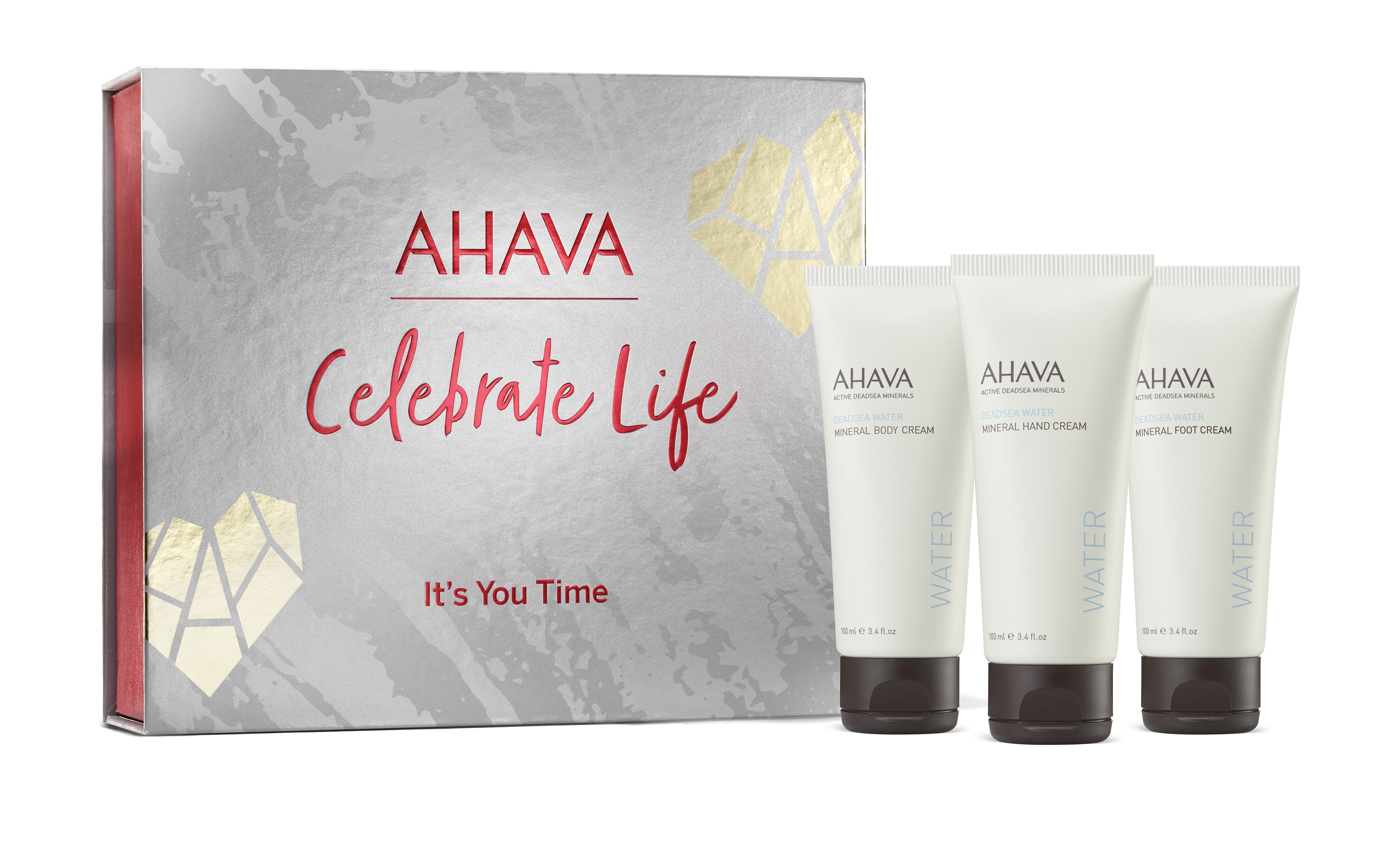 0697045016150 AHAVA Geschenkset mit drei Mineralcremes vor einer grauen Box mit rotem Text 'Celebrate Life'.