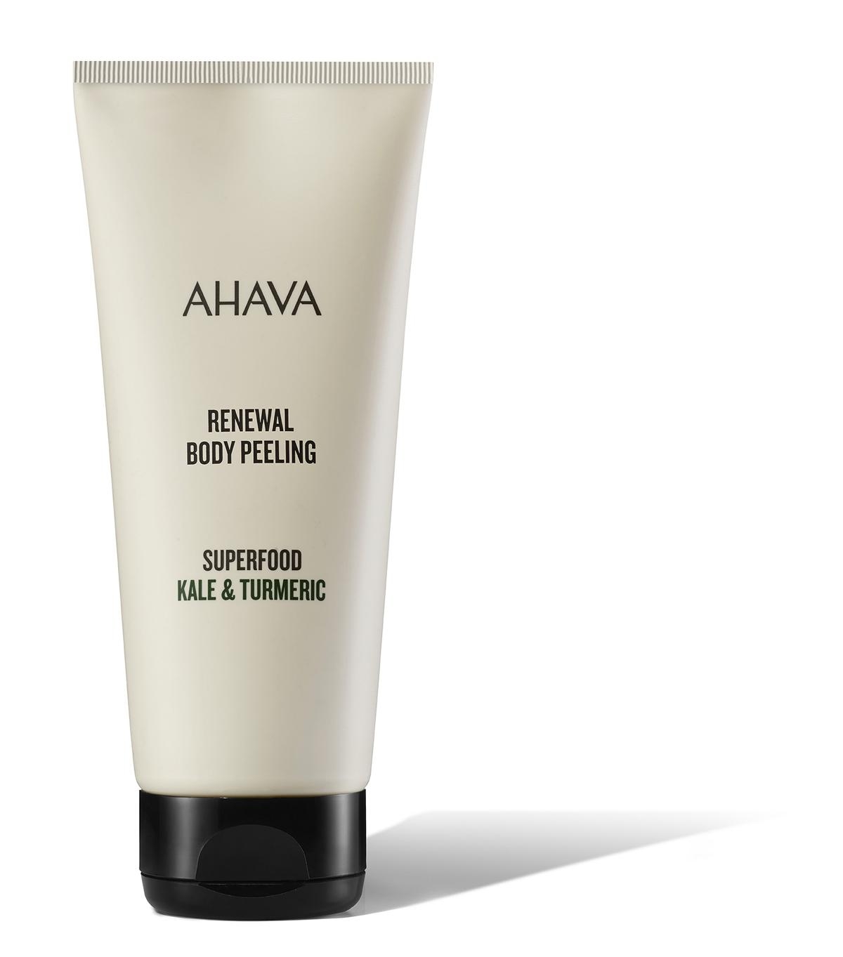 image_120859_2 AHAVA Renewal Body Peeling Superfood Kale & Turmeric in einer weißen Tube mit schwarzem Deckel.